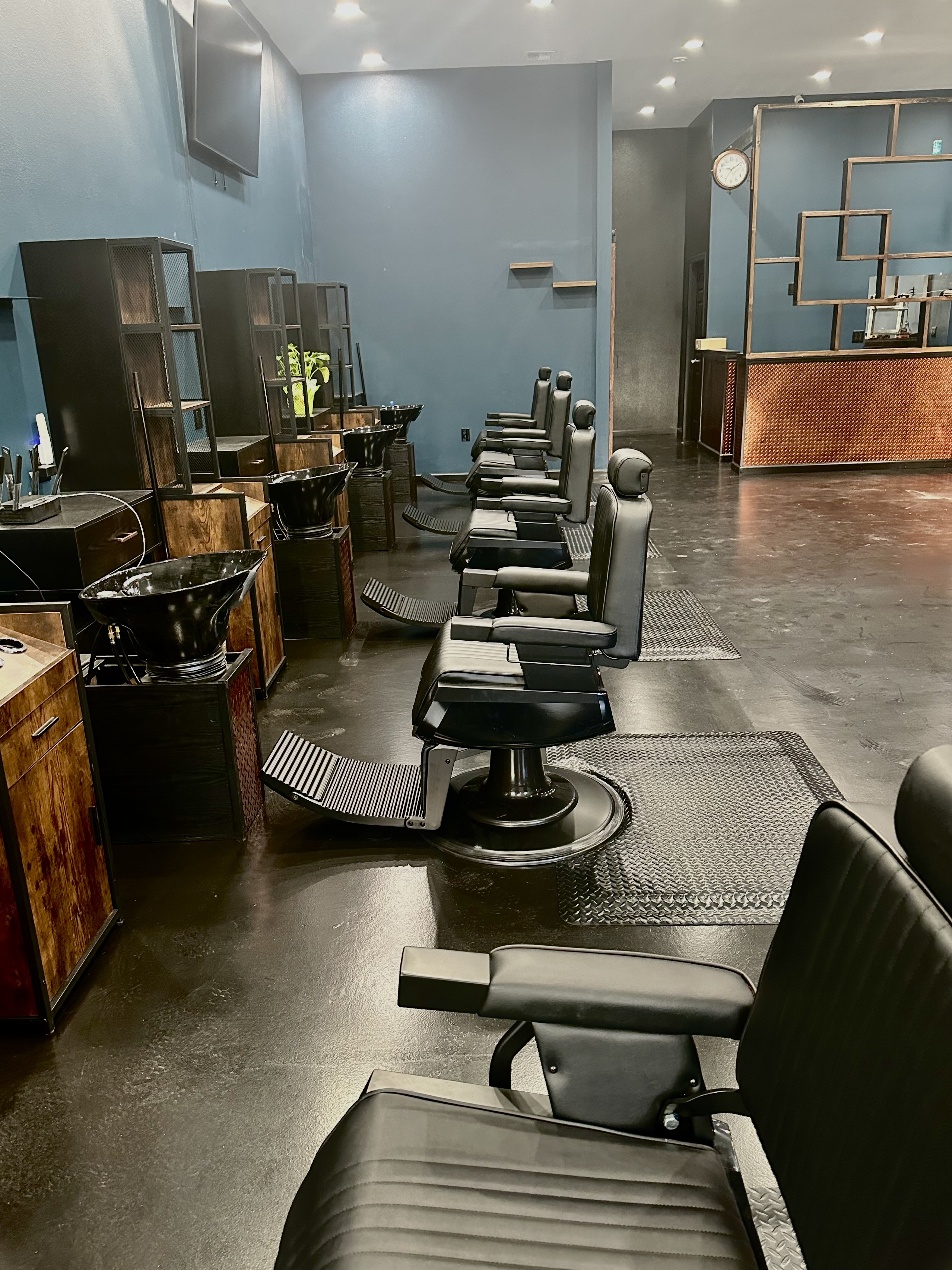Steel & Stubble barbershop interior, clean and modern with product display